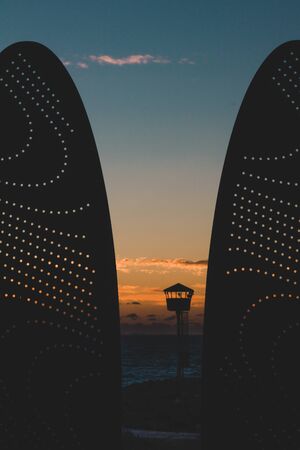 PERTH, WESTERN AUSTRALIA - January 8th, 2020: view of the sunset over the Indian Ocean at City Beach, one of the most popular beaches near Perth on a warm summer dayのeditorial素材