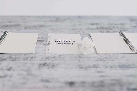 creative block or lack of inspiration conceptual still-life, piece of paper on wooden desk with...