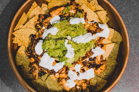 healthy plant-based recipes concept, bean nachos with grilled jackfruit guacamole and vegan aioliの写真素材