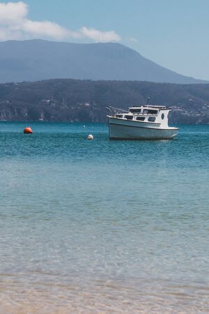 OPOSSUM BAY, TASMANIA - 16th February, 2020: view of Opossum Bay Beach on a sunny summer day with...