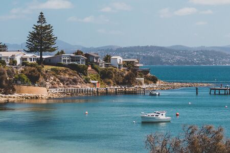 OPOSSUM BAY, TASMANIA - 16th February, 2020: view of Opossum Bay Beach on a sunny summer day with nobody on the beach with deep blue water and clear skies enhancing the beautiful coastline and shoresのeditorial素材