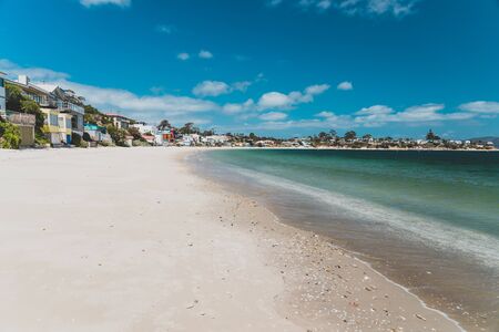 OPOSSUM BAY, TASMANIA - 16th February, 2020: view of Opossum Bay Beach on a sunny summer day with nobody on the beach with deep blue water and clear skies enhancing the beautiful coastline and shoresのeditorial素材