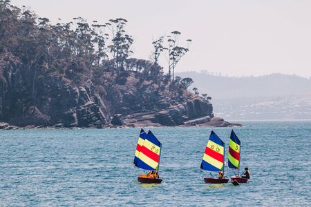 HOBART, TASMANIA - 31st January, 2020: sailing school out in the water in Kingston Beach sailing on...