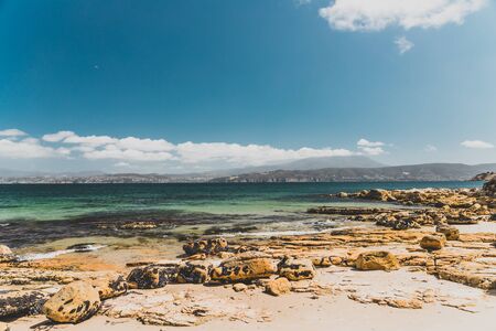 landscape in Opossum Bay Beach on a sunny summer day with nobody on the beach with deep blue water...