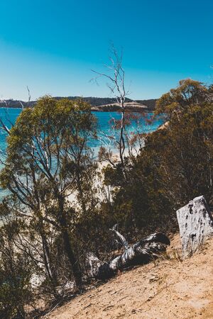 wild Tasmanian landscape and pristine turquoise water of the Derwent River as seen from Legacy Beach walking track near Coningham beach south of Hobartの写真素材