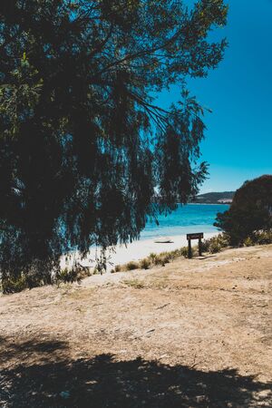 LEGACY BEACH, TASMANIA - February 23rd, 2020: wild Tasmanian landscape and pristine turquoise water of the Derwent River as seen from Legacy Beach walking track near Coningham beach south of Hobartのeditorial素材