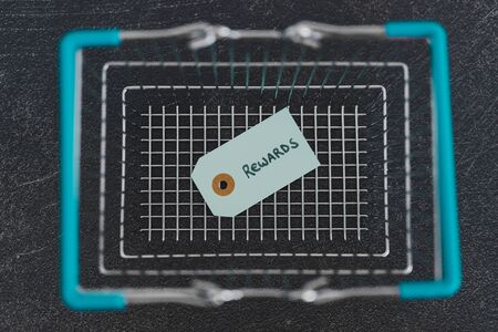 customer rewards and fidelization incentives conceptual still-life, shopping basket with price tag...