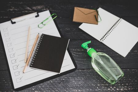 keep your hands clean to fight bacteria and viruses conceptual still-life, hand sanitizer and liquid soap next to memo with Clean your Hands textの写真素材