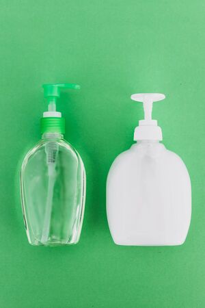 keep your hands clean to fight bacteria and viruses conceptual still-life, hand sanitizer and liquid soap and green backgroundの写真素材