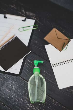 keep your hands clean to fight bacteria and viruses conceptual still-life, hand sanitizer and liquid soap next to memo with Clean your Hands textの写真素材