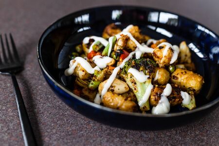 healthy plant-based food recipes, mixed grilled veggies with potato croquettes and veganaise toppingの写真素材
