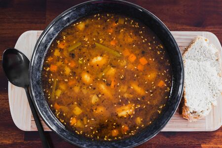 healthy plant-based food recipes, spicy mixed veggies soup with vegan broth and sesame seeds