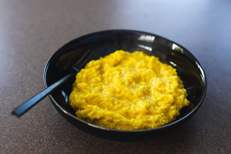 healthy plant-based food recipes concept, vegan turmeric nutritional yeast risotto 