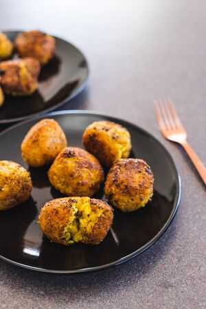 healthy plant-based food recipes concept, deep fried risotto arancini balls with vegan cheese...
