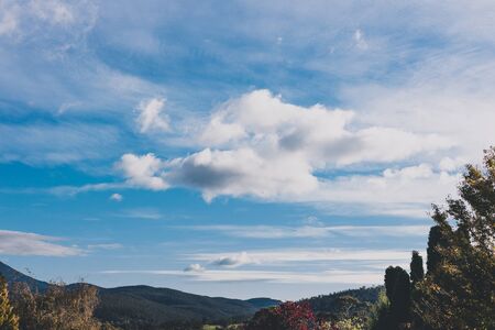 Australian mountain landscape with clouds passing by and weather changing,  shot in Tasmania over Mount Wellingtonの写真素材