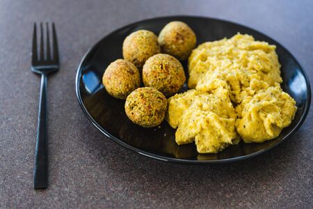 healthy plant-based food recipes concept, vegan chickpea falafels and polentaの写真素材