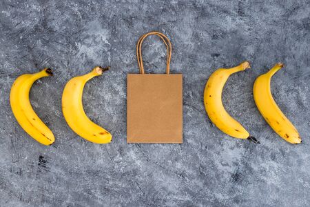 fresh food shopping and home delivery of groceries, bananas with grocery shopping bag among themの写真素材