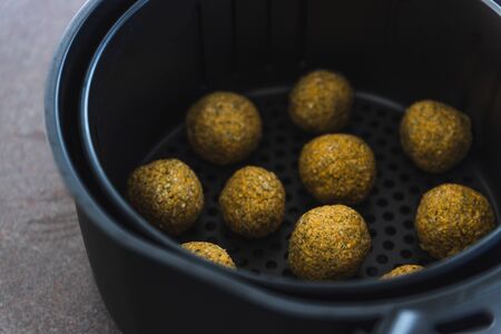 healthy plant-based food recipes concept, vegan chickpea falafels in air fryer basketの写真素材