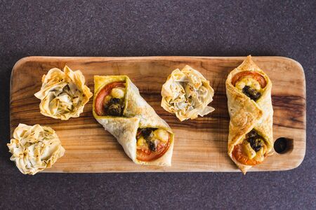 healthy plant-based food recipes concept, filo pastry cups and puff pastry envelopes with vegan...