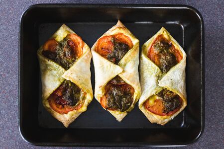 healthy plant-based food recipes concept, vegan tomato capsicum pesto pastries with dairy-free...