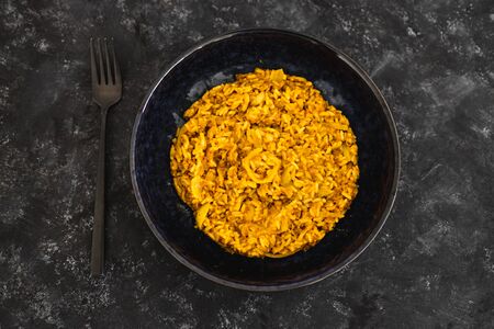 healthy plant-based food recipes concept, vegan fried brown rice with turmeric lentils and onionsの写真素材