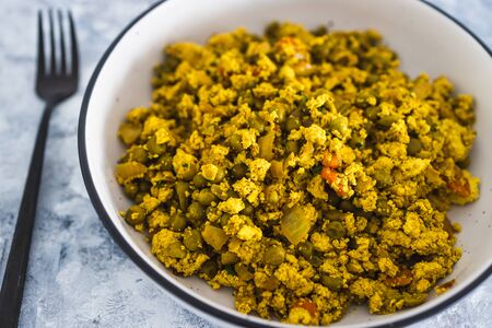 healthy plant-based food recipes concept, vegan scrambled tofu and peas with Indian spicesの写真素材