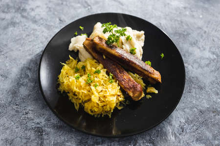 healthy plant-based food recipes concept, vegan sausages with sauerkraut and mash potatoesの写真素材