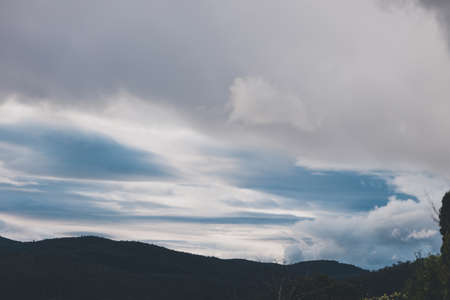morning sky with beautiful clouds rolling over the hills of Tasmania, Australiaの写真素材