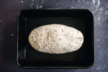simple food ingredients concept, homemade sourdouhg bread on kitchen counterの写真素材