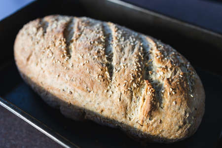 simple food ingredients concept, homemade sourdouhg bread on kitchen counter