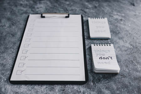 minimalism or self-improvement and introspection concept, notepads with texts Things you need and Things you dont need next to To Do listの写真素材
