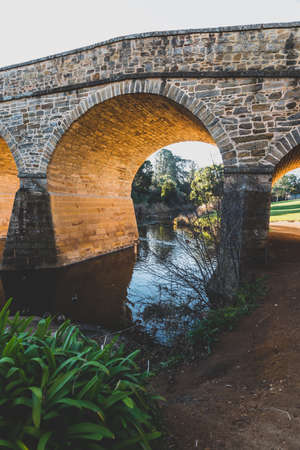 RICHMOND, July 17th, 2020: the Richmond Bridge in Tasmania on a sunny winter day with people...
