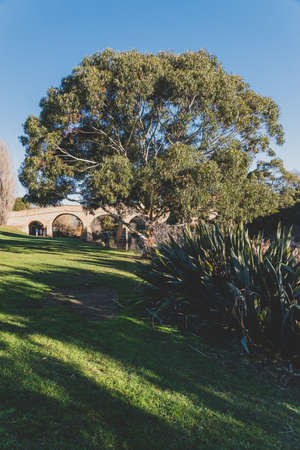 RICHMOND, July 17th, 2020: the Richmond Bridge in Tasmania on a sunny winter day with people...