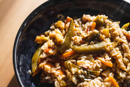 healthy plant-based food recipes concept, vegan fried rice with stir fry vegetables in sweet and sour sauceの写真素材