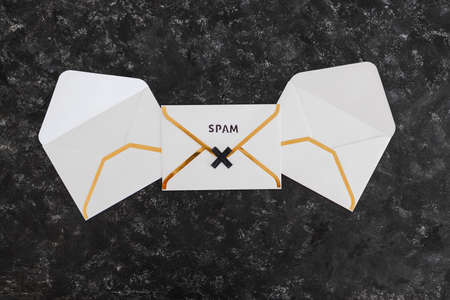 inbox organization and clean-up concept, email envelopes with and without Spam text on themの写真素材