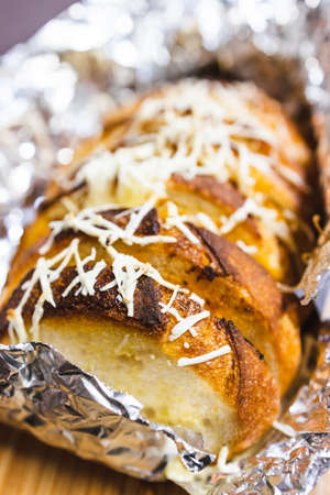 simple food ingredients concept, garlic bread with dairy free cheese topping