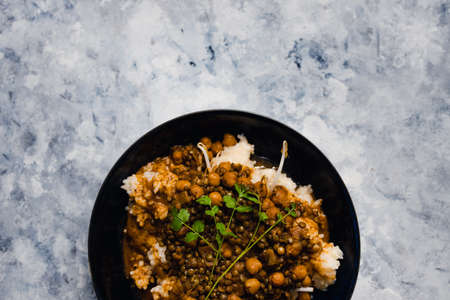 healthy plant-based food recipes concept, vegan rice and beans with mexican spices and cilantro toppingの写真素材