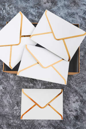 concept of inbox organisation and clean-up, group of envelopes inside box metaphor of email inbox