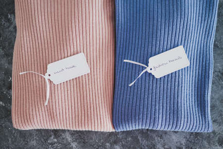 shopping and marketing concept, knit jumpers in alternative colours with Must Have and Fashion...