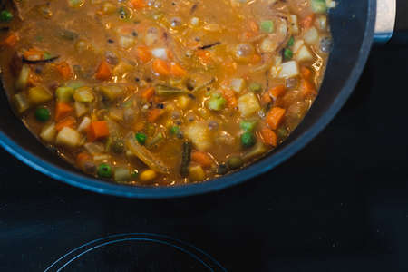 healthy plant-based food recipes concept, vegan stew with garden vegetables rice and cajun spices
