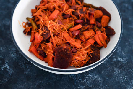 healthy plant-based food recipes concept, vegan beetroot and thai vegetables stir fry with...