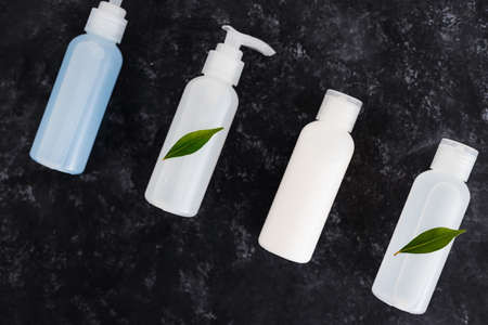 natural and cruelty-free beauty products concept, group of lotions and moisturizers with green leavesの写真素材