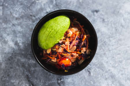 healthy plant-based food recipes concept, vegan salad bowl with teriyaki sauce salad mix almonds and avocadoの写真素材
