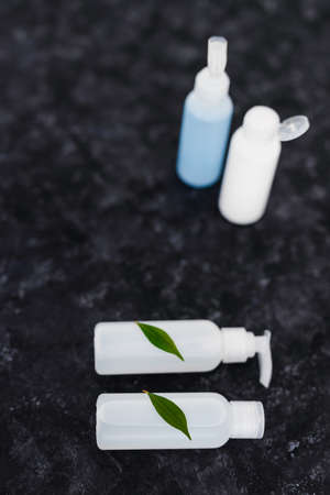 natural and cruelty-free beauty products concept, group of lotions and moisturizers with green...