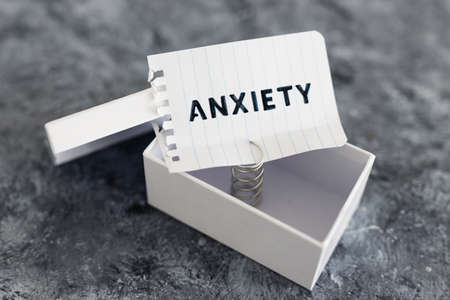 psychology and mental health concept, memo with text Anxiety inside of white box metaphor of mind strugglesの写真素材