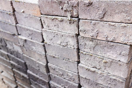group of outdoor paver bricks stacked up in a wall