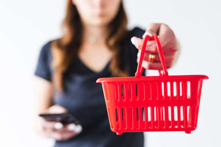 concept of influencer marketing or reading product reviews before purchasing, woman holding shopping...