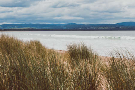 beautiful view of Seven Mile Beach just outside the city of Hobart in Tasmania, Australia on an...