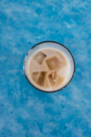 drinks and beverages, iced coffee with almon milk in tall glass