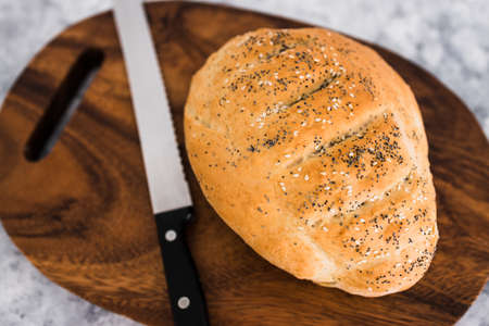 simple food ingredients concept, homemade australian damper bread without yeast freshly made and on...